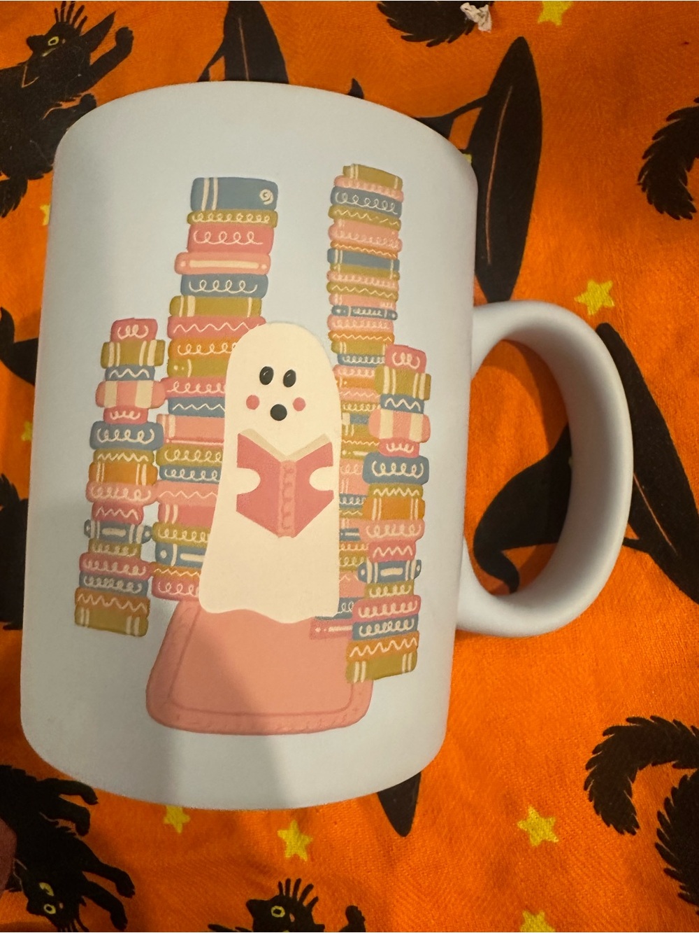 Source Unknown White Mug with Pink-Accented Reading Ghost
